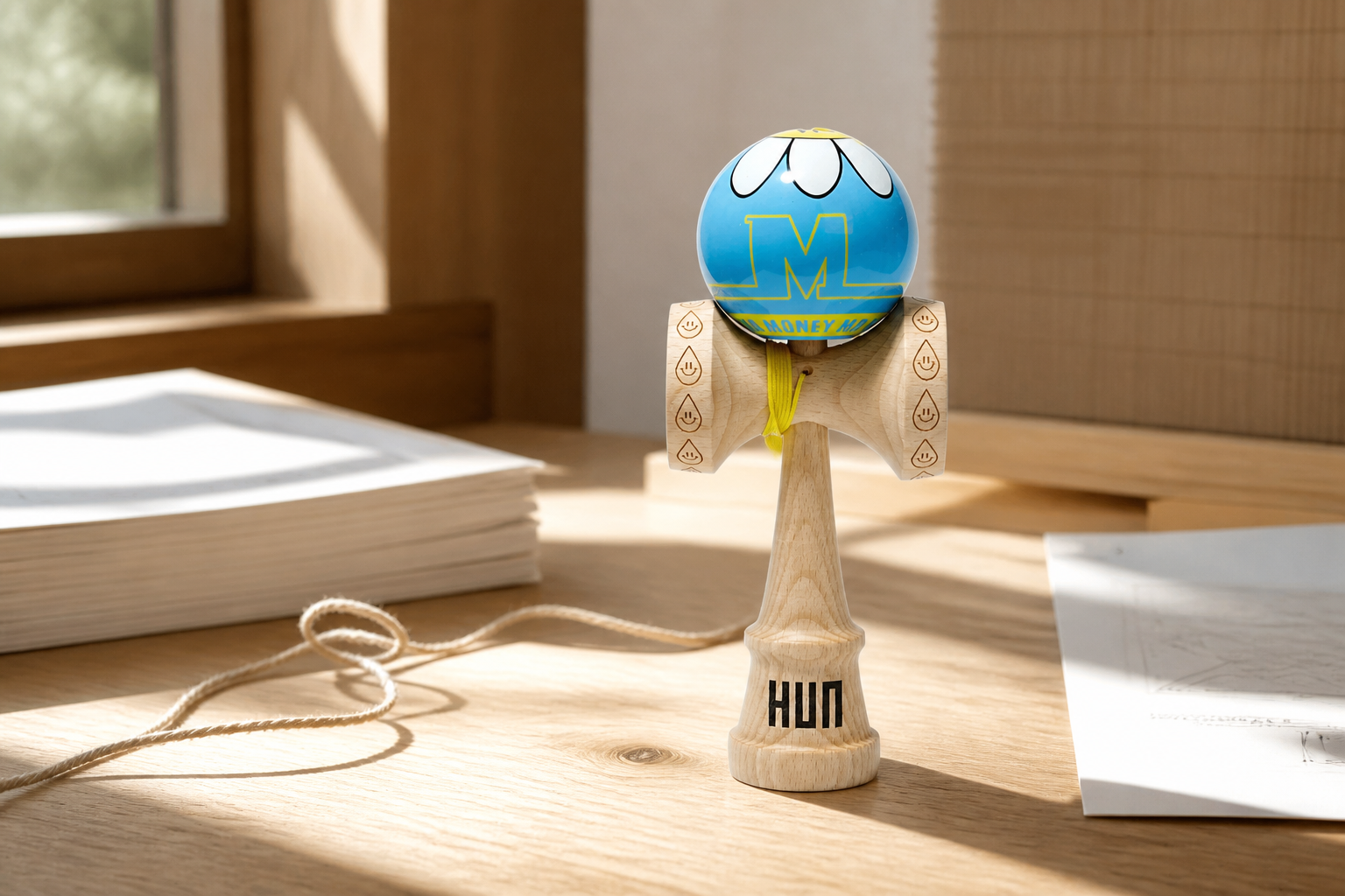 MEDM Daisy kendama in a sunlit wood studio