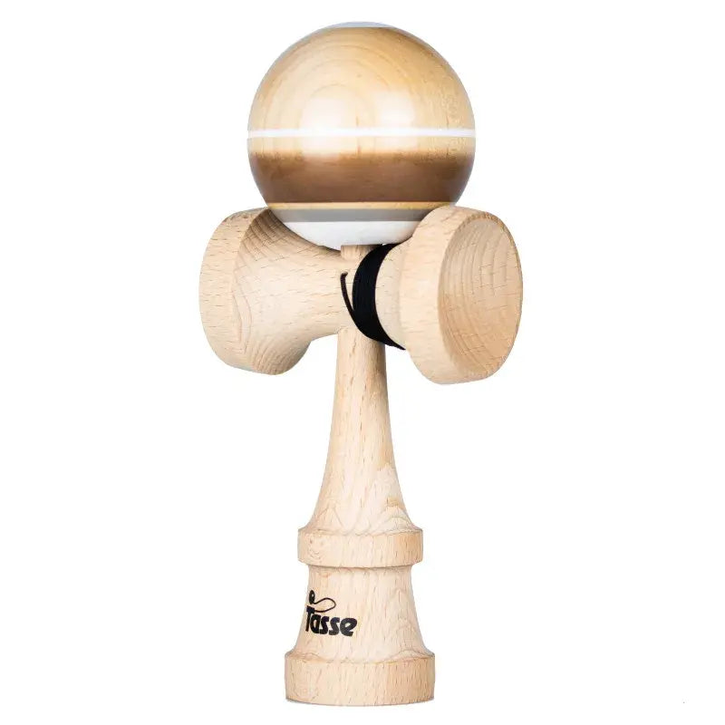 Tasse wooden kendama with a glossy natural wood and brown ball, white stripe detail, and natural wood handle, isolated on a light gray background.