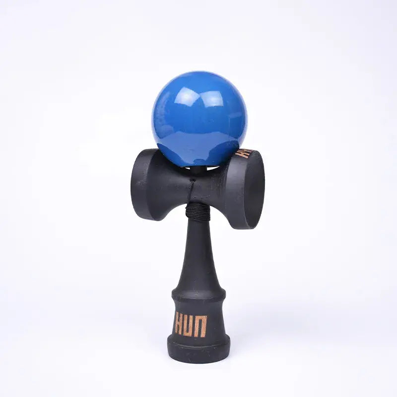 HUN kendama with a glossy blue ball, black wooden handle, and light background.