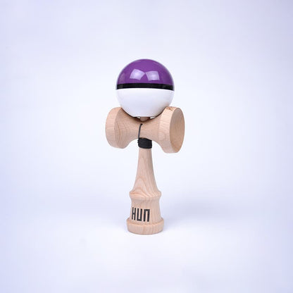 HUN Kendama Kylin Model with a glossy purple and white ball, black stripe detail, natural wood handle, and light background.