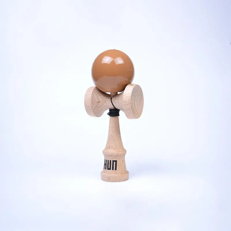 HUN Kendama Kylin Model with a glossy brown ball, natural wood handle, and light background.