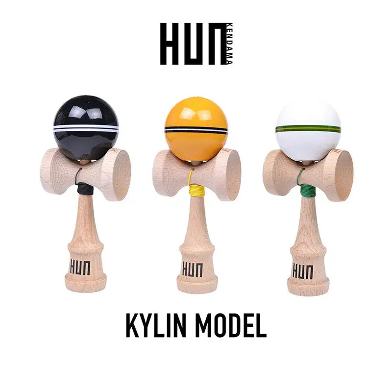 HUN Kendama Kylin Model product image featuring three wooden kendamas with glossy black, yellow, and white balls on a light gray background.