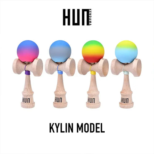 HUN Kendama Kylin Model product image featuring four wooden kendamas with gradient balls in pink-blue, blue-gray, rainbow, and yellow-blue tones on a light gray background.