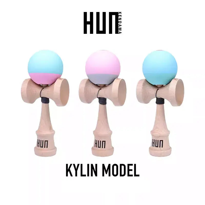 HUN Kendama Kylin Model product image featuring three wooden kendamas with pastel gradient balls in blue, pink, and gray tones on a light gray background.
