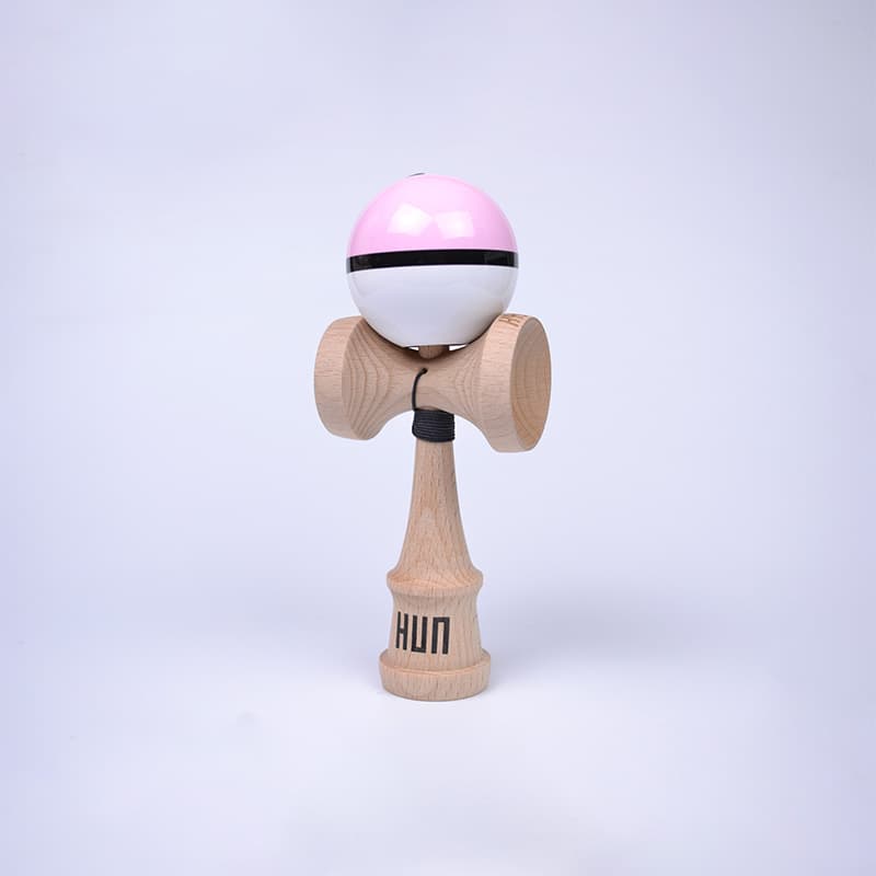 HUN Kendama Kylin Model with a glossy pink and white ball, black stripe detail, natural wood handle, and light background.