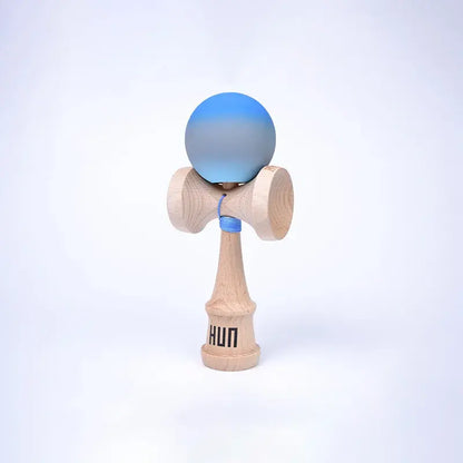 HUN Kendama Kylin Model with a blue and gray gradient ball, natural wood handle, and light background.