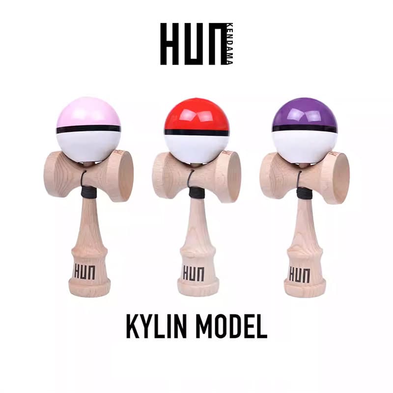 HUN Kendama Kylin Model product image featuring three wooden kendamas with glossy pink, red, and purple balls on a light gray background.