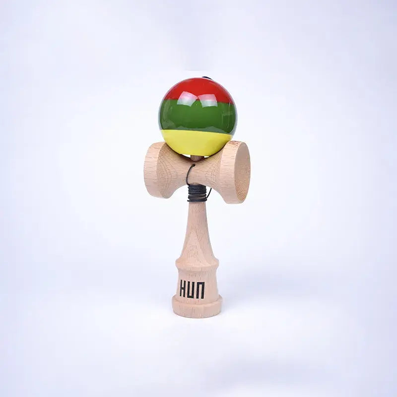 HUN Kendama Kylin Model with a glossy red, green, and yellow striped ball, natural wood handle, and light background.