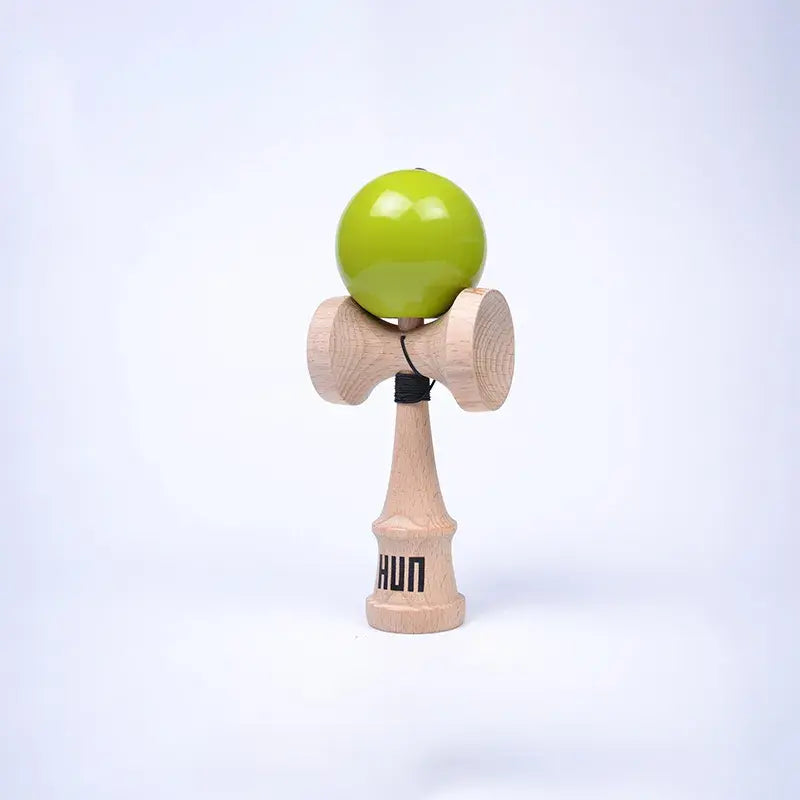 HUN Kendama Kylin Model with a glossy lime green ball, natural wood handle, and light background.