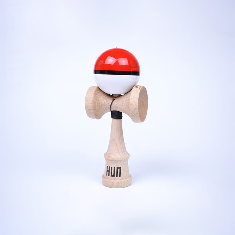 HUN Kendama Kylin Model with a glossy red and white ball, black stripe detail, natural wood handle, and light background.